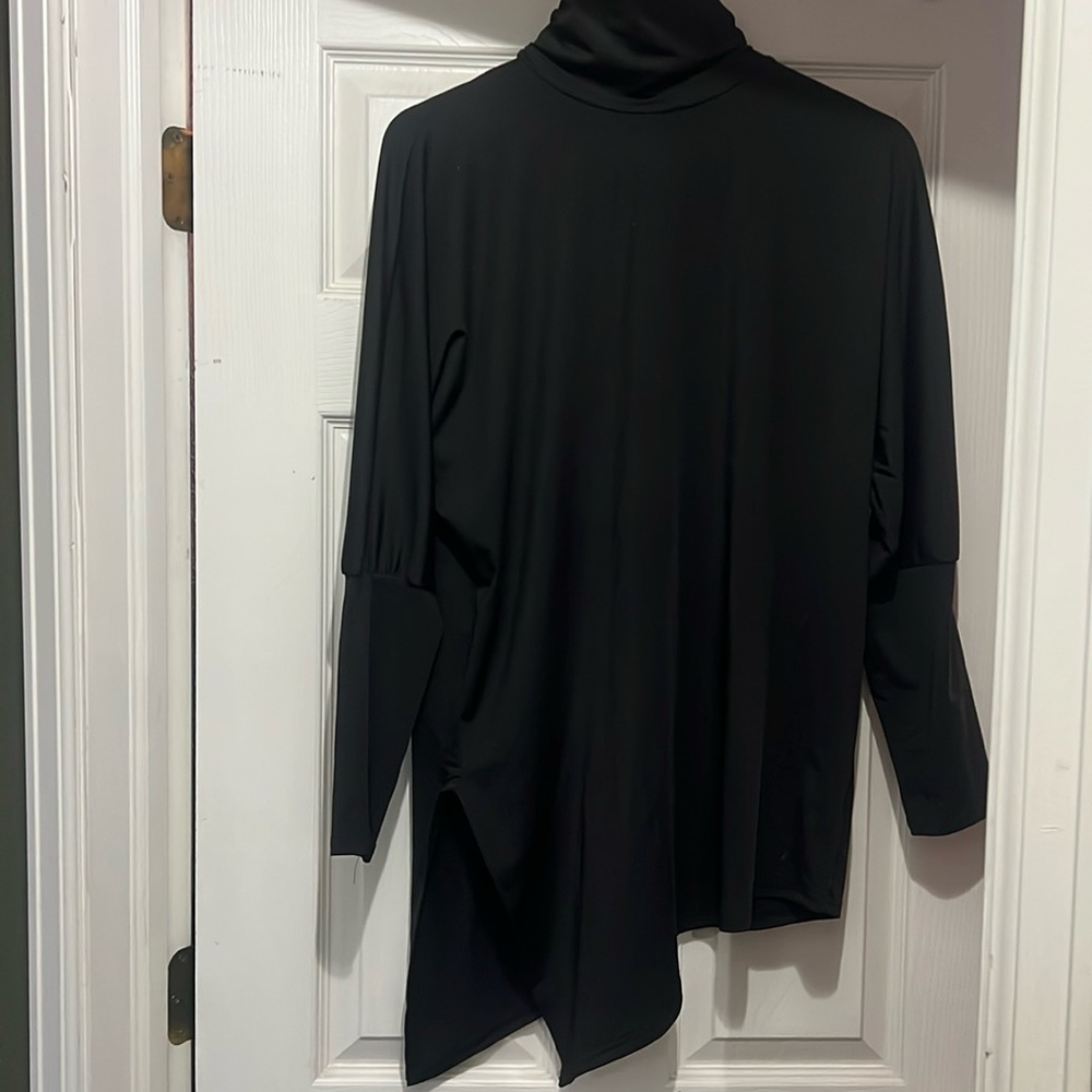 Asymmetrical black top with long sleeves
